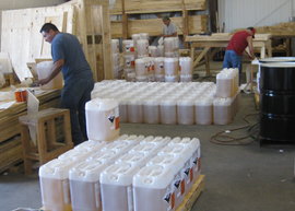 Hazardous liquid containers being crated