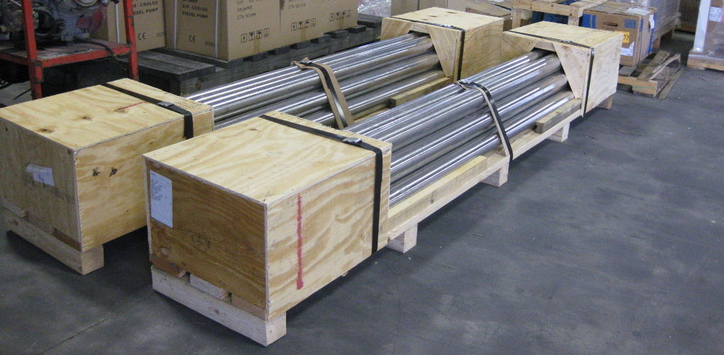 Pipes straddled inside of two crates